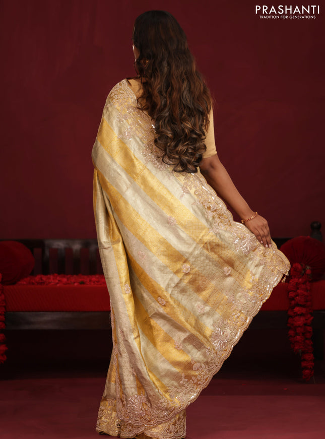 Pure tissue kanchipuram silk saree with allover zari weaves & border embroidery
