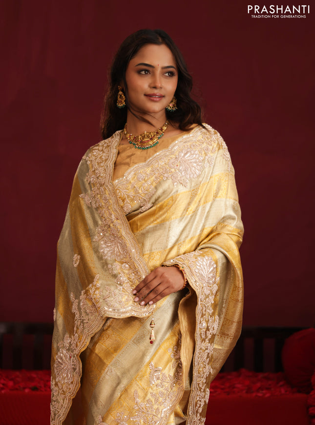 Pure tissue kanchipuram silk saree with allover zari weaves & border embroidery