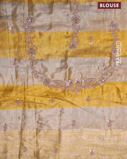 Pure tissue kanchipuram silk saree with allover zari weaves & border embroidery