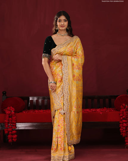 Yellow banarasi uppada silk saree with allover mina weaves & border embroidery