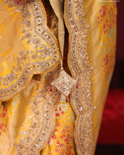 Yellow banarasi uppada silk saree with allover mina weaves & border embroidery