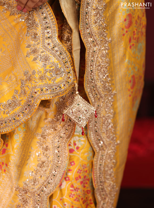 Yellow banarasi uppada silk saree with allover mina weaves & border embroidery