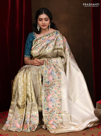 Elaichi Green Pure Kanchipuram Silk Saree With Silver Zari Buttas & Border Embroidery