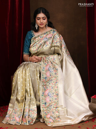 Elaichi Green Pure Kanchipuram Silk Saree With Silver Zari Buttas & Border Embroidery