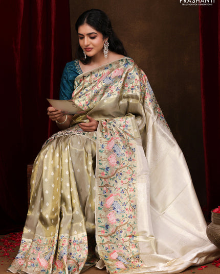 Elaichi Green Pure Kanchipuram Silk Saree With Silver Zari Buttas & Border Embroidery