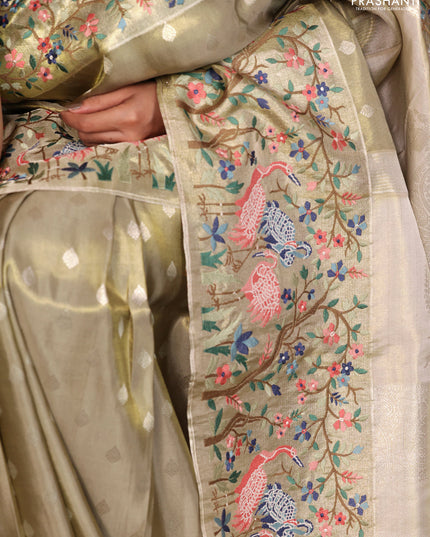 Elaichi Green Pure Kanchipuram Silk Saree With Silver Zari Buttas & Border Embroidery