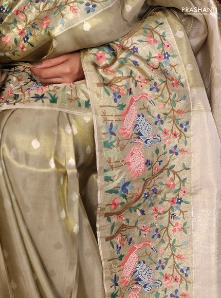 Elaichi Green Pure Kanchipuram Silk Saree With Silver Zari Buttas & Border Embroidery
