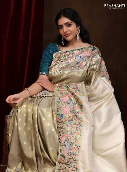 Elaichi Green Pure Kanchipuram Silk Saree With Silver Zari Buttas & Border Embroidery