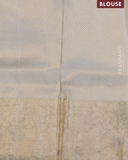 Elaichi Green Pure Kanchipuram Silk Saree With Silver Zari Buttas & Border Embroidery