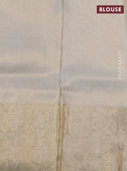 Elaichi Green Pure Kanchipuram Silk Saree With Silver Zari Buttas & Border Embroidery