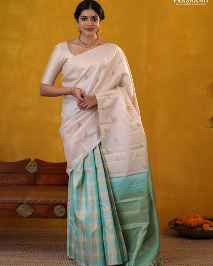 Off white-Teal blue Pure Kanchipuram silk saree With Zari woven peacock buttas