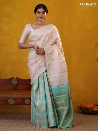 Off white-Teal blue Pure Kanchipuram silk saree With Zari woven peacock buttas