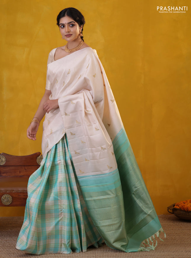 Off white-Teal blue Pure Kanchipuram silk saree With Zari woven peacock buttas
