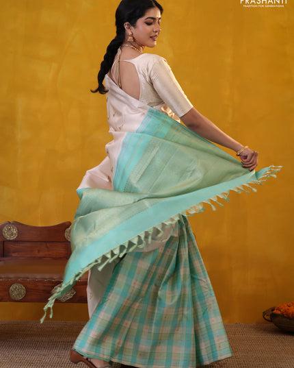 Off white-Teal blue Pure Kanchipuram silk saree With Zari woven peacock buttas
