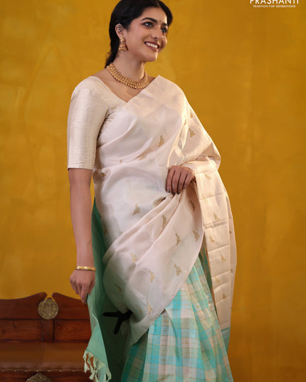 Off white-Teal blue Pure Kanchipuram silk saree With Zari woven peacock buttas
