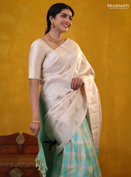 Off white-Teal blue Pure Kanchipuram silk saree With Zari woven peacock buttas