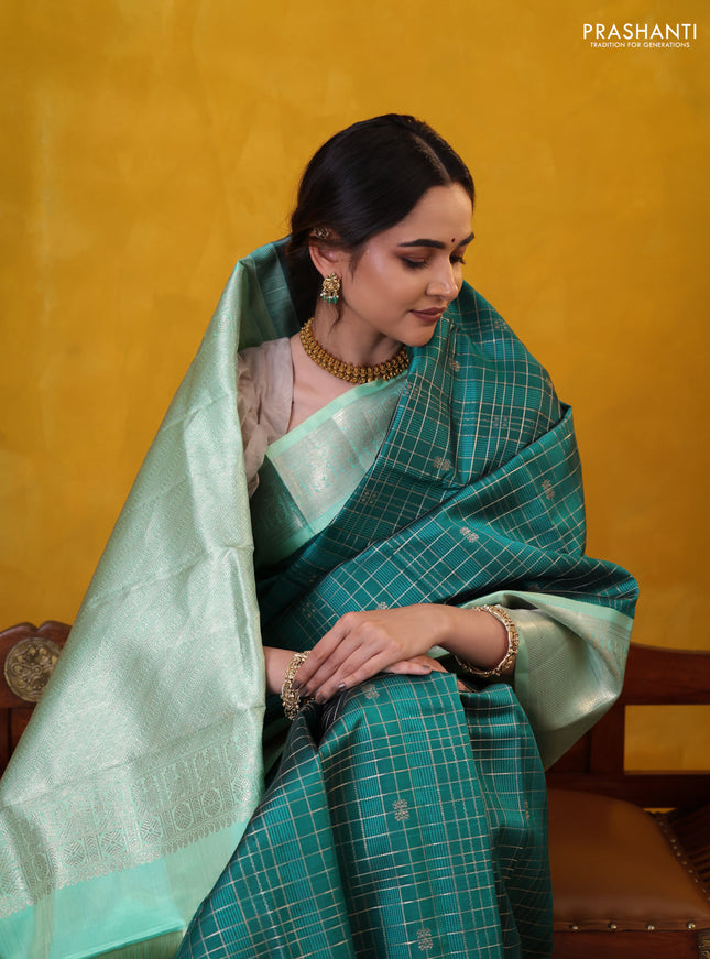 Peacock green-teal shade pure kanchipuram silk saree with allover zari checked pattern