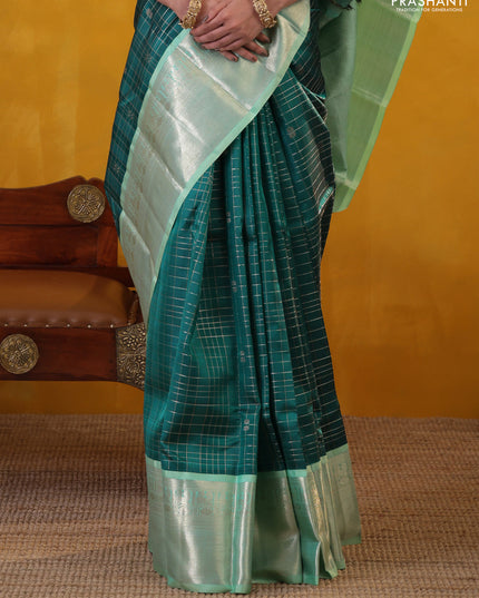 Peacock green-teal shade pure kanchipuram silk saree with allover zari checked pattern