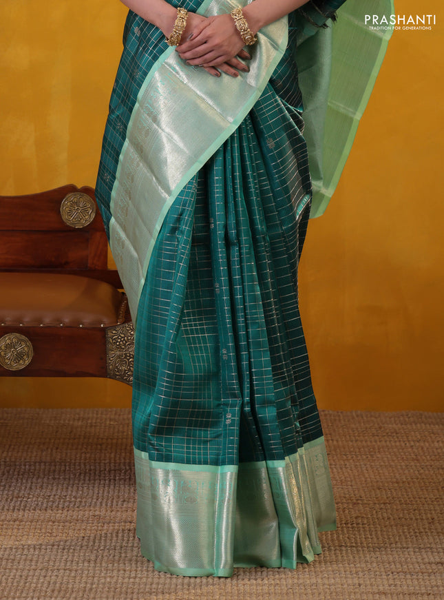 Peacock green-teal shade pure kanchipuram silk saree with allover zari checked pattern
