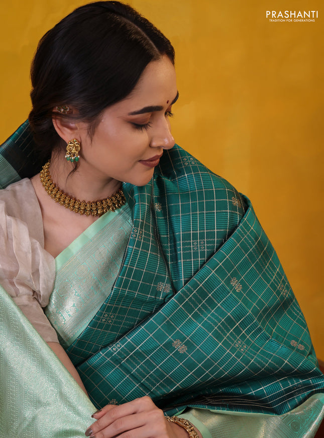 Peacock green-teal shade pure kanchipuram silk saree with allover zari checked pattern