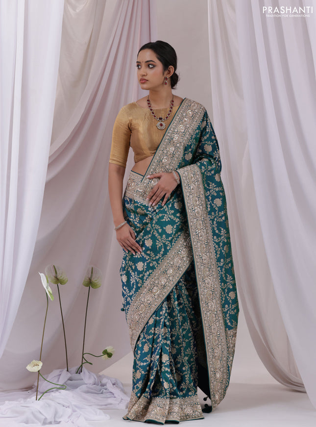Teal Blue Banarasi Uppada silk saree with allover zari weaves & embroidery border