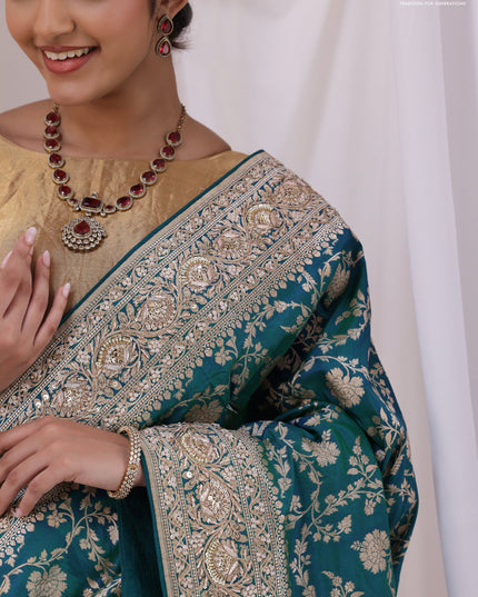 Teal Blue Banarasi Uppada silk saree with allover zari weaves & embroidery border