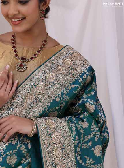 Teal Blue Banarasi Uppada silk saree with allover zari weaves & embroidery border
