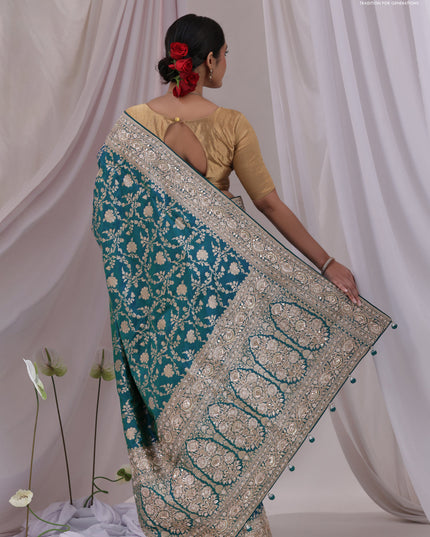 Teal Blue Banarasi Uppada silk saree with allover zari weaves & embroidery border