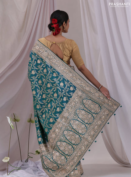 Teal Blue Banarasi Uppada silk saree with allover zari weaves & embroidery border