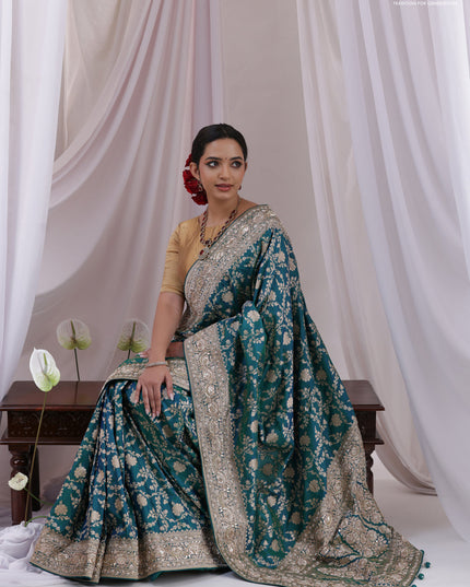 Teal Blue Banarasi Uppada silk saree with allover zari weaves & embroidery border