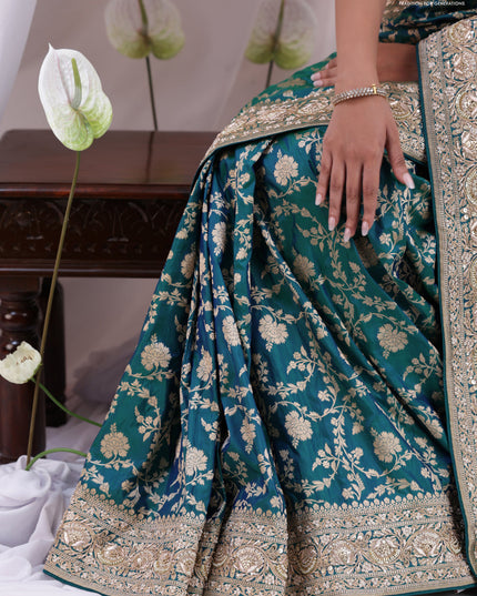 Teal Blue Banarasi Uppada silk saree with allover zari weaves & embroidery border
