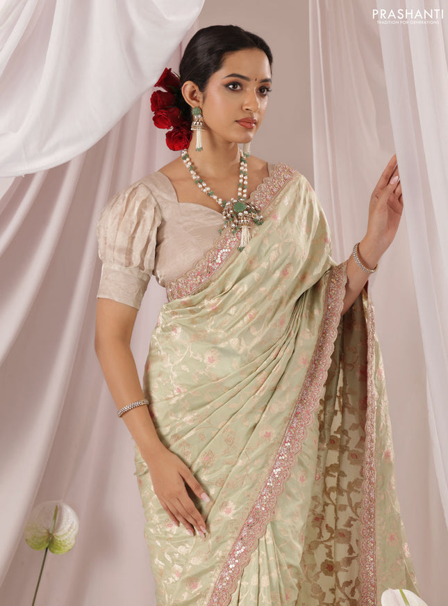 Pastel Green-Peach Pink Banarasi Uppada silk saree with allover zari weaves & embroidery border