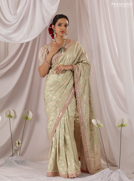 Pastel Green-Peach Pink Banarasi Uppada silk saree with allover zari weaves & embroidery border