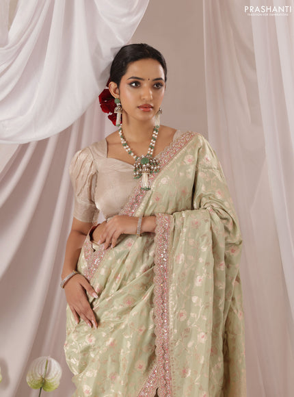Pastel Green-Peach Pink Banarasi Uppada silk saree with allover zari weaves & embroidery border