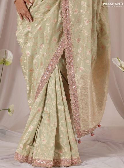 Pastel Green-Peach Pink Banarasi Uppada silk saree with allover zari weaves & embroidery border