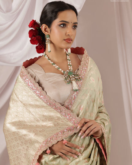 Pastel Green-Peach Pink Banarasi Uppada silk saree with allover zari weaves & embroidery border
