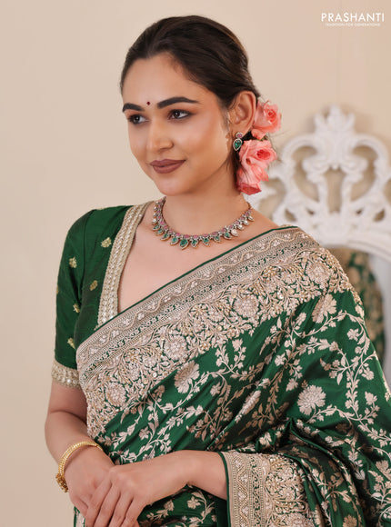 Green Banarasi Uppada silk saree with allover zari weaves & embroidery border