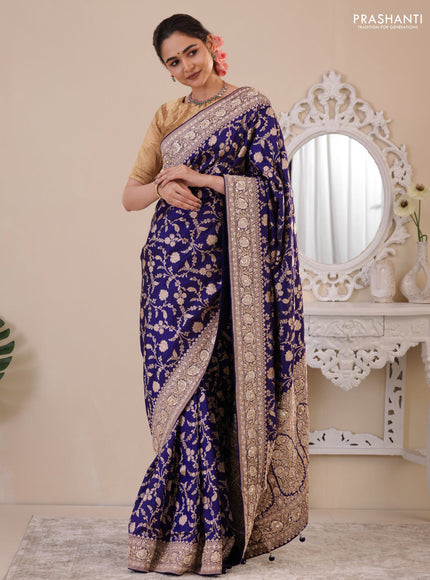Blue Banarasi Uppada silk saree with allover zari weaves & embroidery border