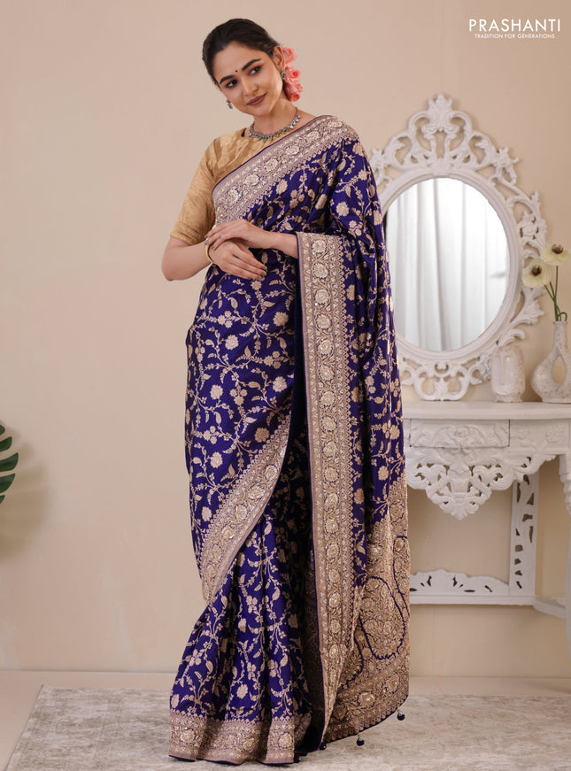 Blue Banarasi Uppada silk saree with allover zari weaves & embroidery border
