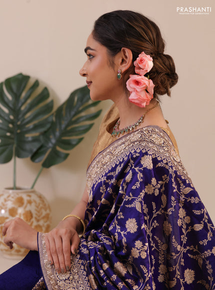 Blue Banarasi Uppada silk saree with allover zari weaves & embroidery border