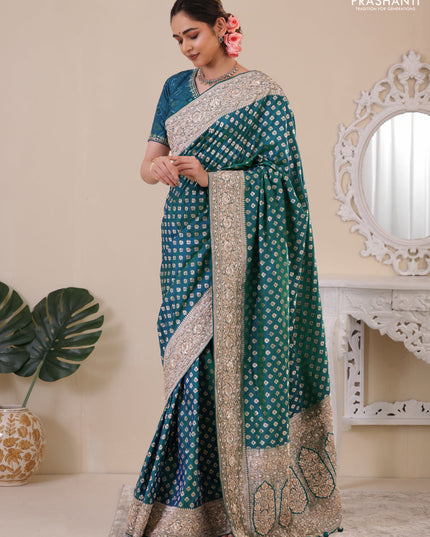 Teal Green Banarasi Uppada silk saree with allover zari woven buttas & embroidery border