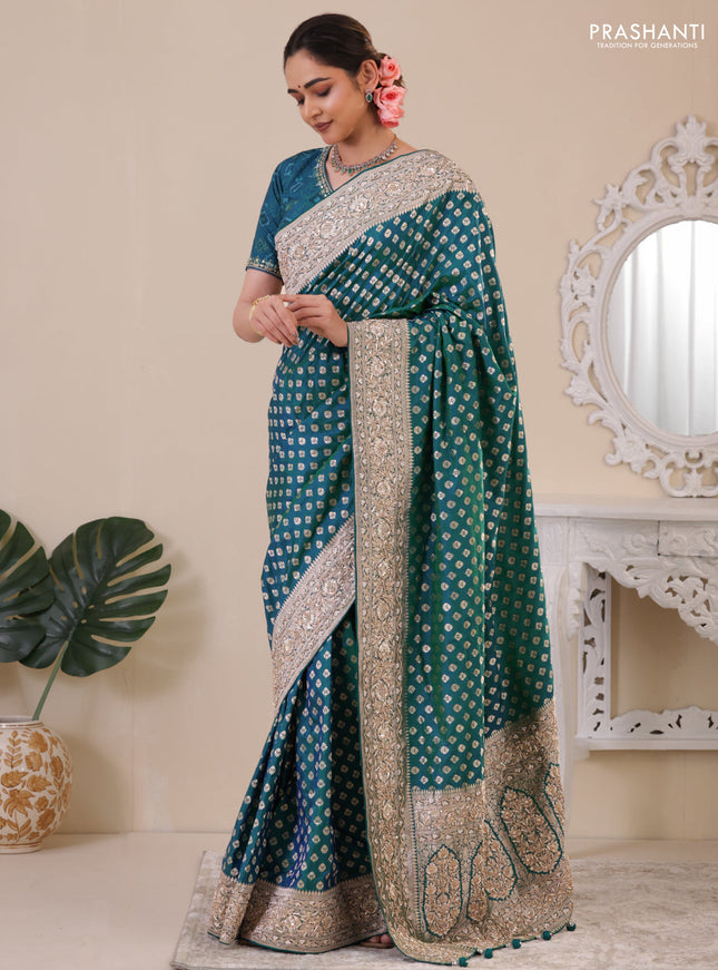 Teal Green Banarasi Uppada silk saree with allover zari woven buttas & embroidery border