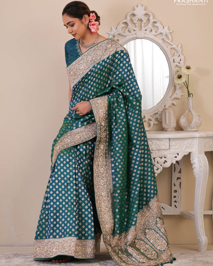 Teal Green Banarasi Uppada silk saree with allover zari woven buttas & embroidery border