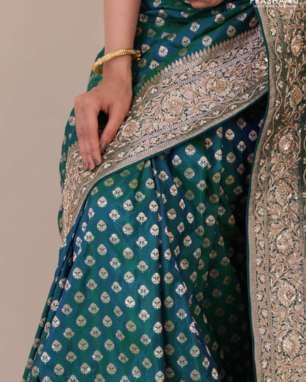 Teal Green Banarasi Uppada silk saree with allover zari woven buttas & embroidery border