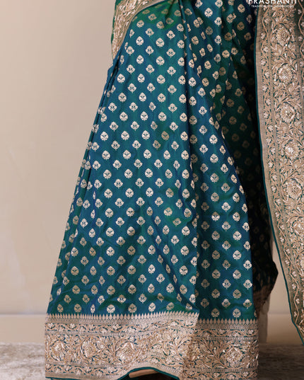 Teal Green Banarasi Uppada silk saree with allover zari woven buttas & embroidery border