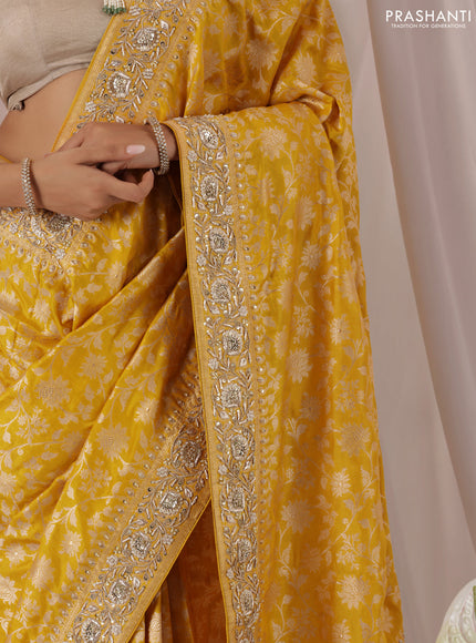 Mango yellow Banarasi Uppada silk saree with allover zari weaves & embroidery border