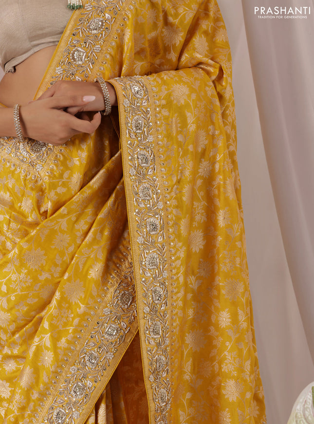 Mango yellow Banarasi Uppada silk saree with allover zari weaves & embroidery border