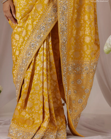 Mango yellow Banarasi Uppada silk saree with allover zari weaves & embroidery border