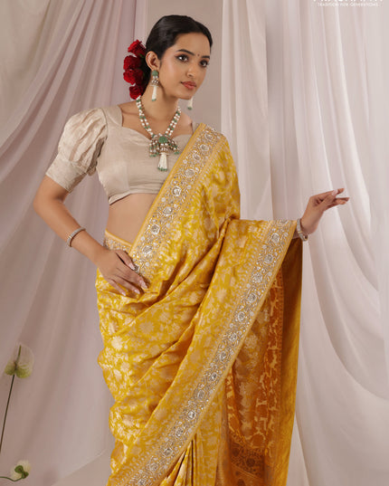 Mango yellow Banarasi Uppada silk saree with allover zari weaves & embroidery border