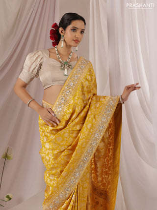 Mango yellow Banarasi Uppada silk saree with allover zari weaves & embroidery border